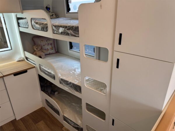  wardrobes on either side of the Queen bed and a cupboard towards the back of the van for the kids gear.<br /><br />Battery